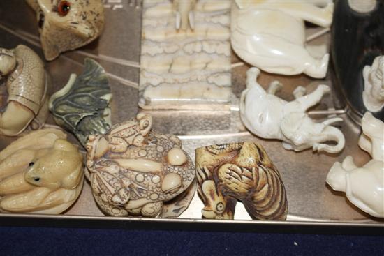 A group of assorted pre WWII ivory carving, mostly animals, together with several resin carvings